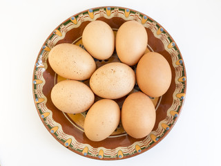 Eggs in painted ceramic plate