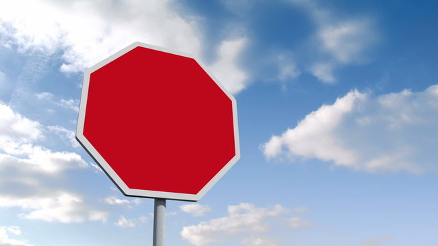 Empty red road sign over cloudy sky