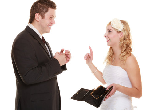 Couple groom and bride with empty purse, conflict.