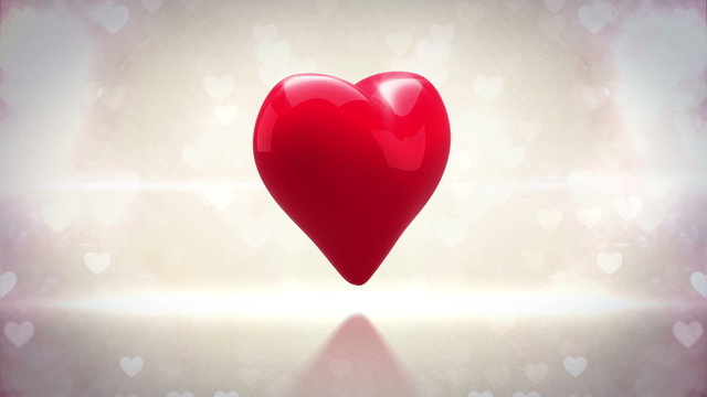 Red heart turning and exploding on glittering background