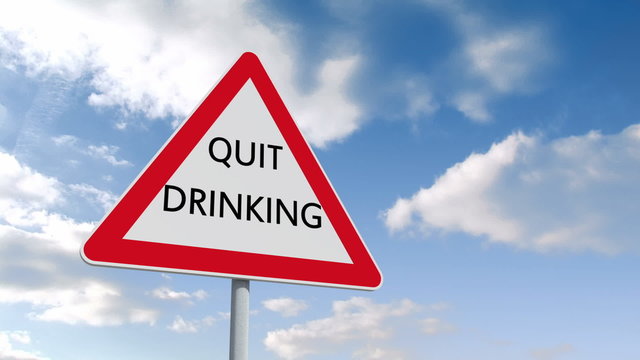 Quit drinking sign against blue sky