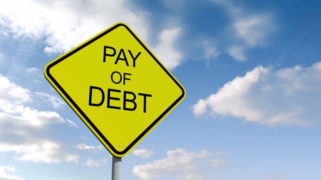 Pay off debt sign against blue sky