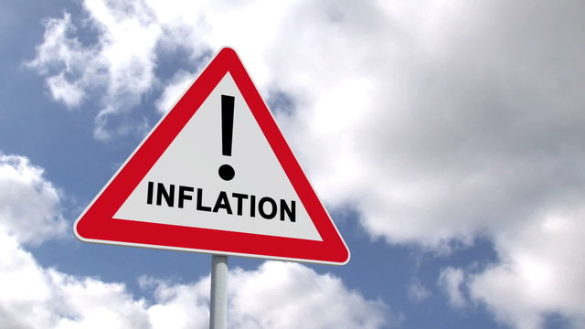 Inflation sign against blue sky