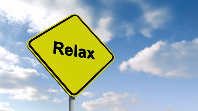 Relax sign against blue sky