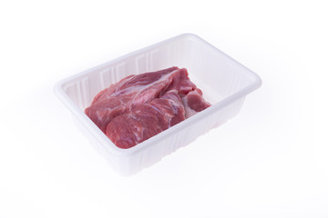 raw pork in plastic box package isolated on white background
