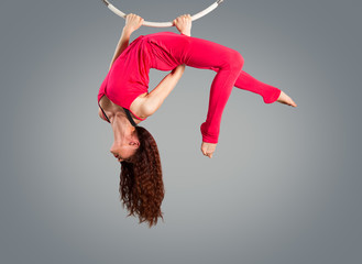 Plastic beautiful girl gymnast on acrobatic circus ring