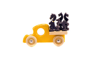 Obraz na płótnie Canvas retro wooden car toy with horse chess group isolated on white