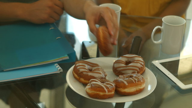 Students taking donuts during meeting