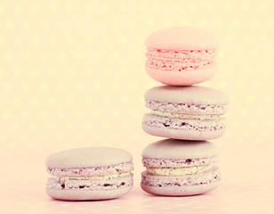 Tasty macaroons on color background