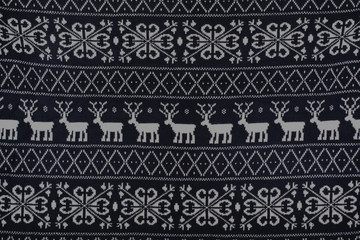 winter knitted pattern with deer and snowflakes