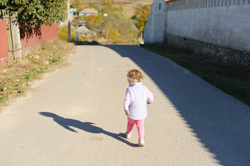 Girl Walking on Road