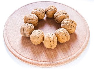 Walnuts on rustic  wooden table