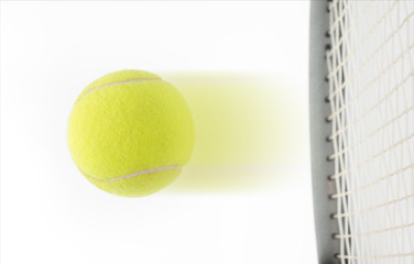 Fast speeding tennis ball being hit by a raquet