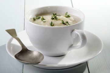cup with creamy cauliflower soup