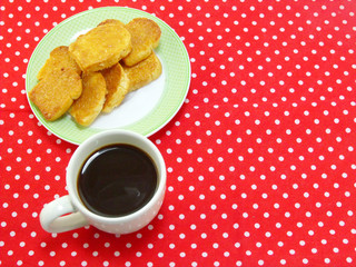 coffee time with garlic bread on red polka dot fabric