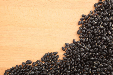 Black beans on wood table