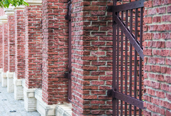 fence made of red brick