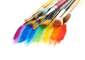 Obraz premium Pile of different brushes over the paint strokes