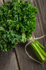 Organic fresh parsley on wooden background. 