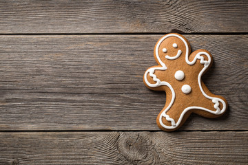 Gingerbread cookie on wooden background 
