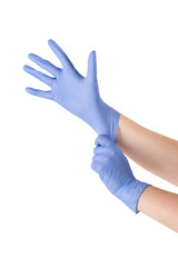 Woman putting on protective gloves. Doctor wears medical gloves.