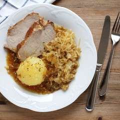 German Schweinebraten with potato dumpling and sauerkraut