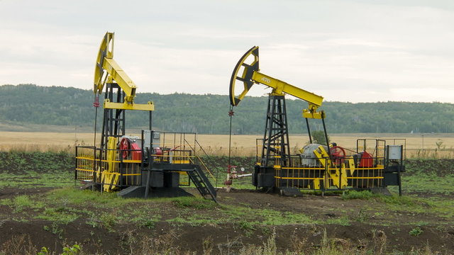 Two oil pumps at work