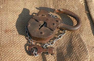 Old rusty lock with key