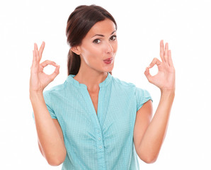 Cute woman in blue blouse gesturing a great job
