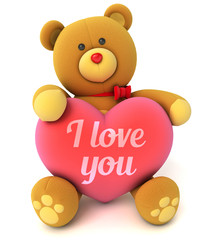 Toy teddy bear holding a heart with the words I love you