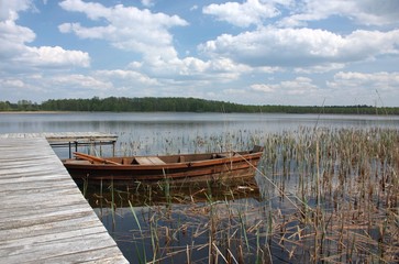 Obraz premium Boats moored on the lake Grutas. Lithuania