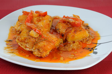 Fish dish with onions and peppers sauce