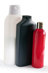 colored plastic bottles with shampoo