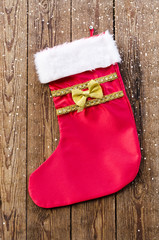 Christmas sock on a wooden background