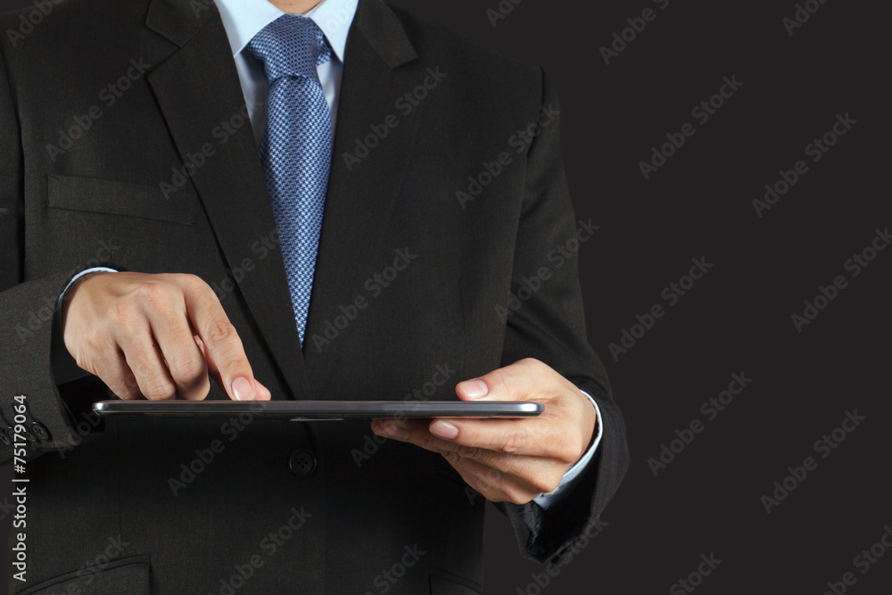 Wall mural businessman hand using tablet computer