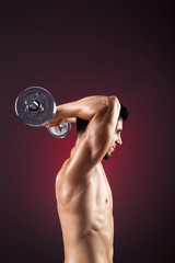 Fototapeta na wymiar Fitness man lifting weights with curl bar