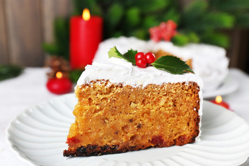 Slice of cake covered cream with Christmas decoration