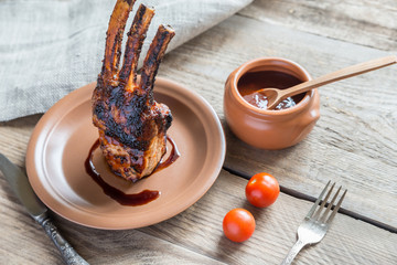Grilled pork ribs on the wooden background