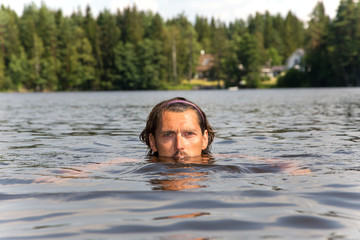 Swimming training of sportsman in lake © Vanoa2