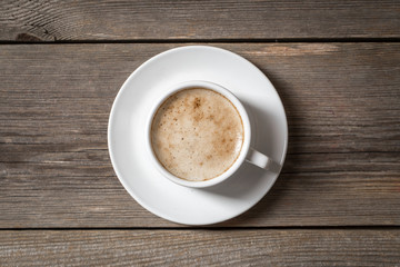 White coffee cup on wooden table