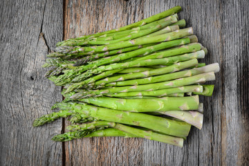 Fresh Asparagus on Rustic Wood Background