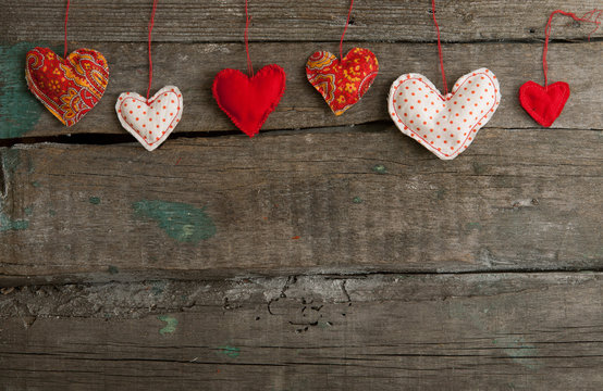lot of hearts on wooden background
