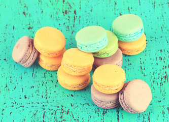 Macaroons on wooden surface close-up