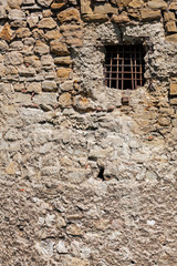 old stone wall with window