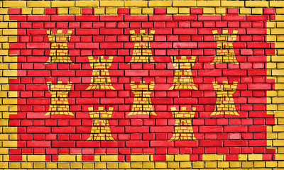 flag of Greater Manchester painted on brick wall