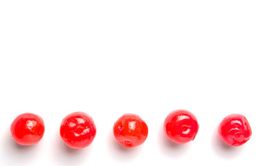 Pickled cherry fruit over white background