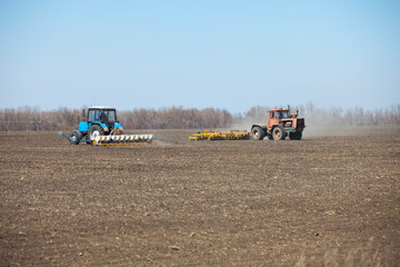 Fototapeta premium Sowing and harrowing in the spring