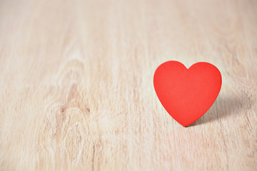 Red hearts on wooden background