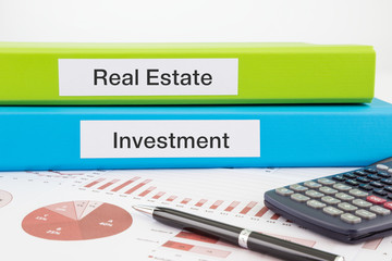 Real estate and investment documents with reports