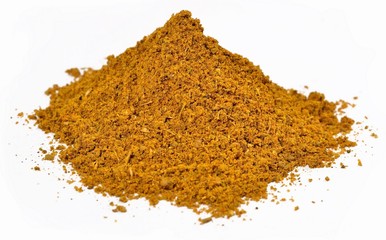 Heap of curry powder  on a white